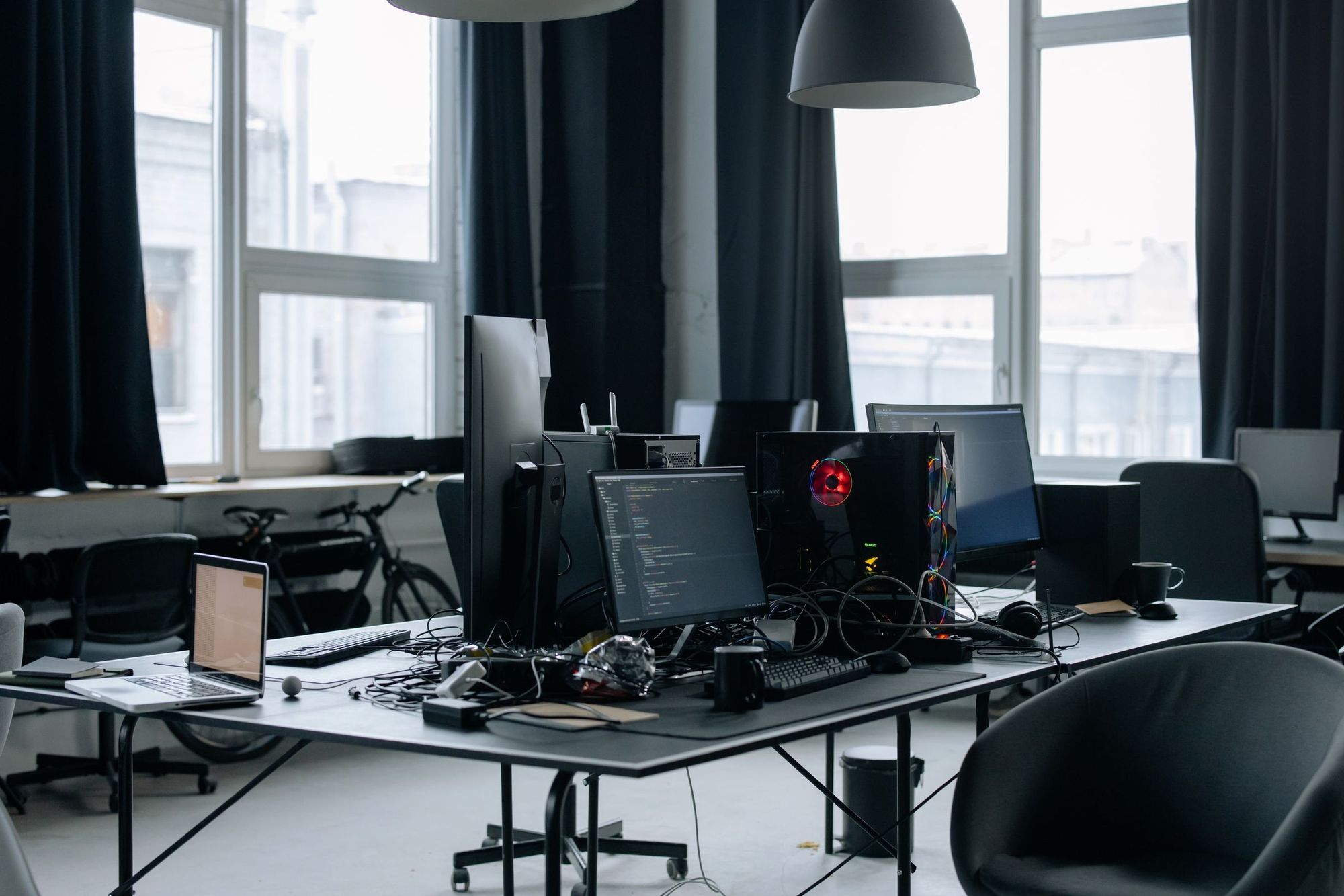 An office of desks with computers and monitors